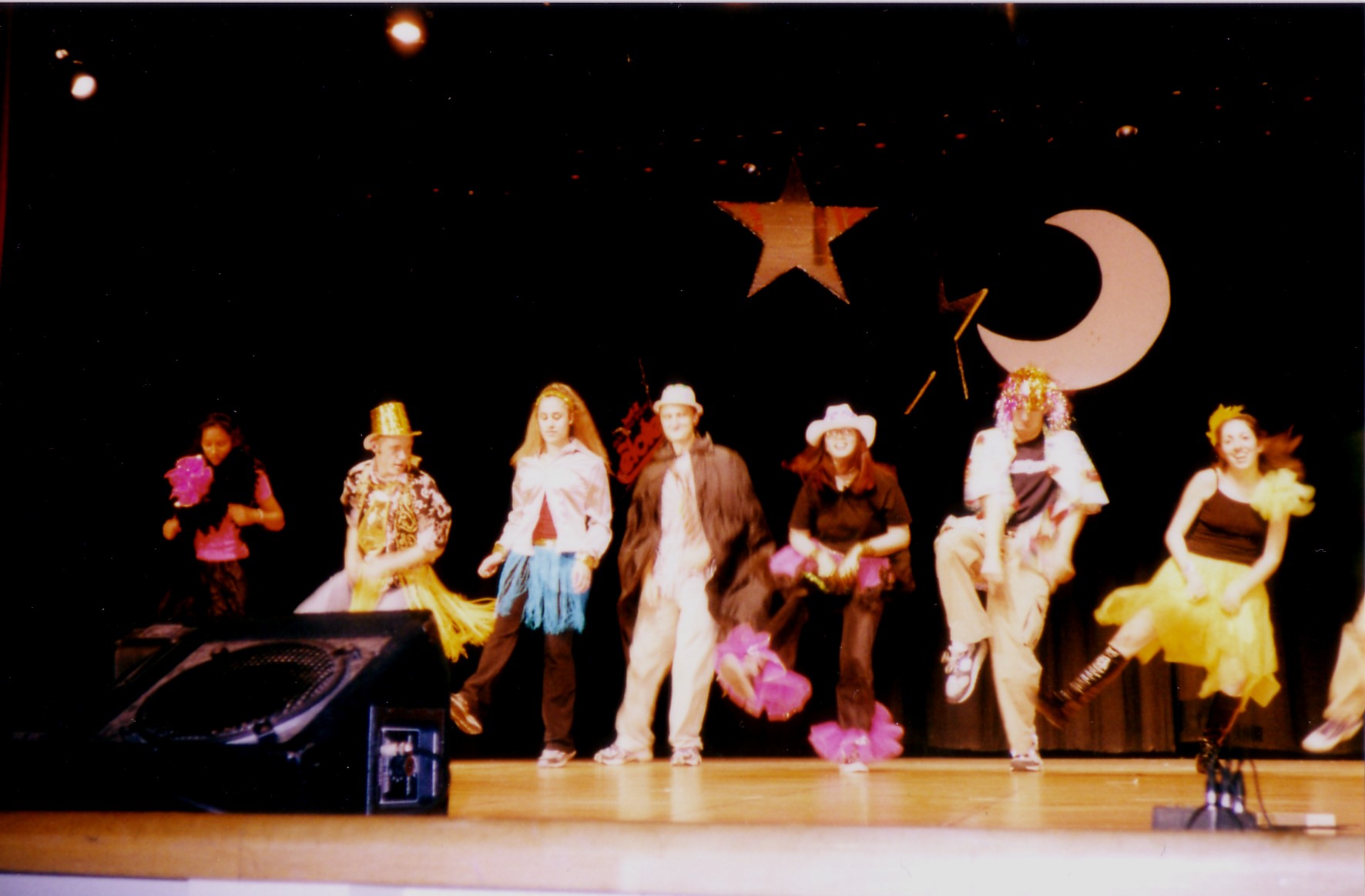 The cast kicking their heels up Rockette style