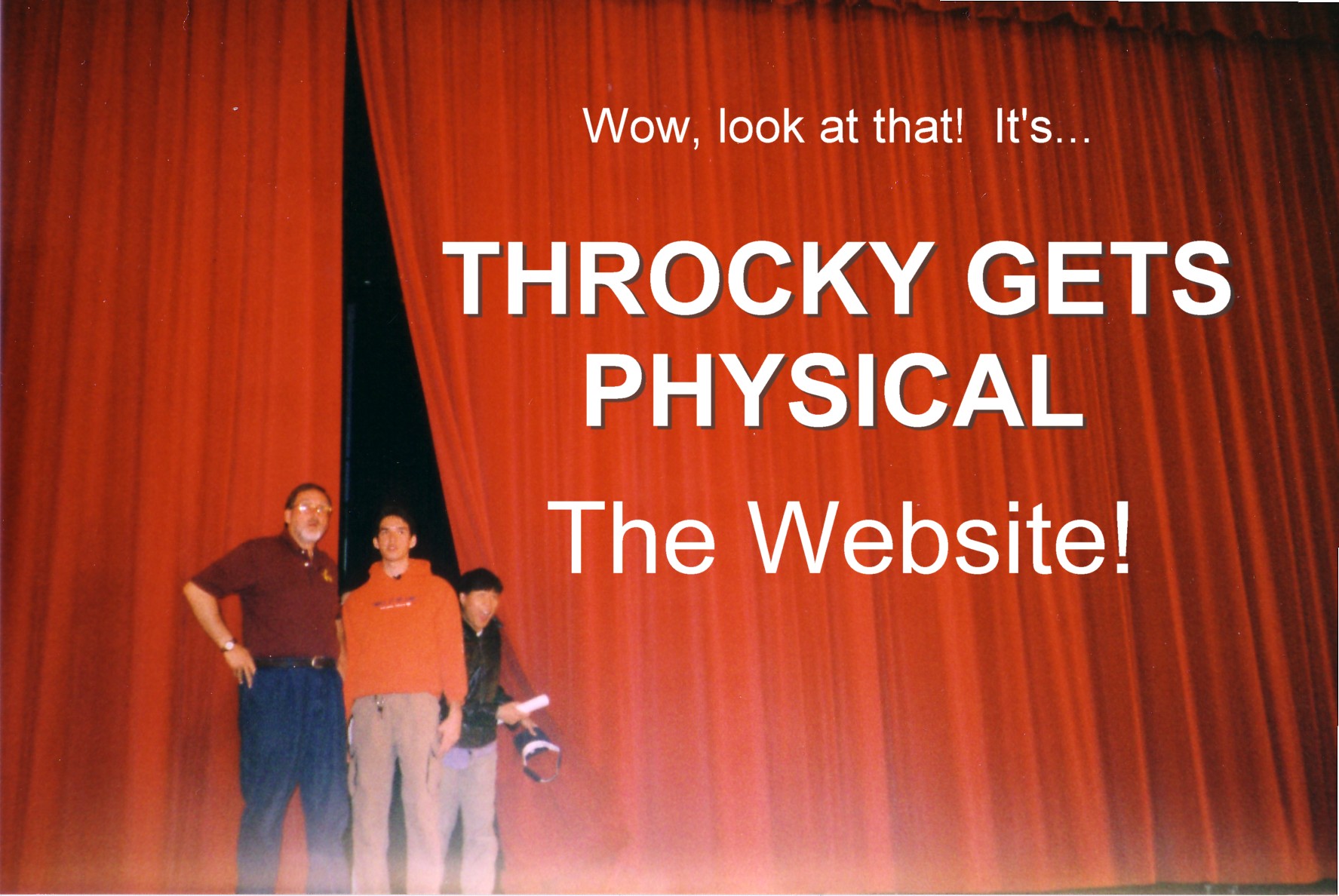 Nelson, his Dad, and Sam peering out from behind the curtains of the Morristown High School stage